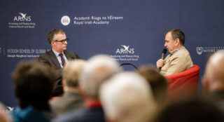 View from the crowd of Colin Graham in conversation with Pat Fenlon.