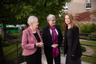 Mary Canning, Maeve Collins and Sally Hayden outside on the top step